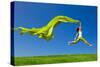 Beautiful Young Woman Jumping On A Green Meadow With A Colored Tissue-iko-Stretched Canvas