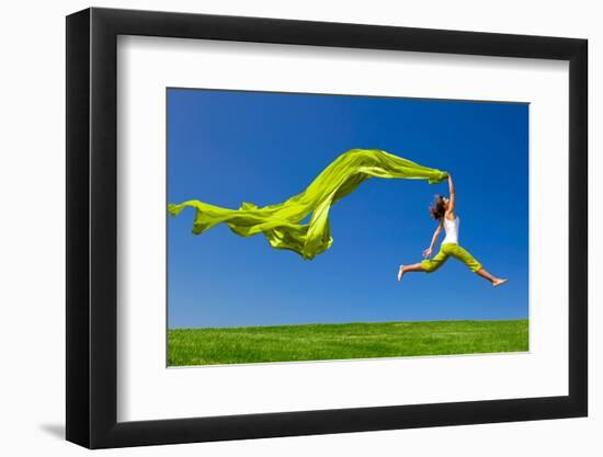 Beautiful Young Woman Jumping On A Green Meadow With A Colored Tissue-iko-Framed Photographic Print
