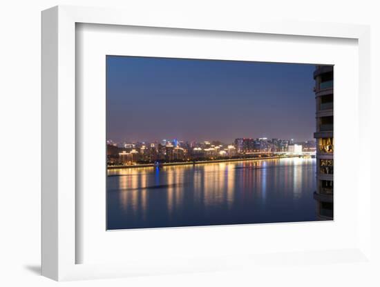 Beautifully illuminated high rises on Qiantang River in Hangzhou, Zhejiang province, China, Asia-Andreas Brandl-Framed Photographic Print