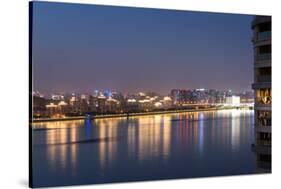 Beautifully illuminated high rises on Qiantang River in Hangzhou, Zhejiang province, China, Asia-Andreas Brandl-Stretched Canvas