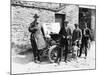 Bedford Standing at the Front of a Car, with Onlookers-null-Mounted Photographic Print