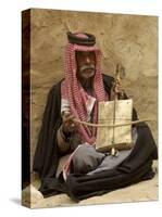 Bedouin Man in Traditional Dress Playing a Musical Instrument, Beida, Jordan, Middle East-Sergio Pitamitz-Stretched Canvas