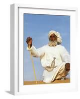 Bedouin Man Kneels on Top of a Sand Dune in the Desert-John Warburton-lee-Framed Photographic Print