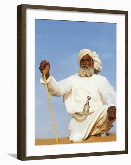 Bedouin Man Kneels on Top of a Sand Dune in the Desert-John Warburton-lee-Framed Photographic Print