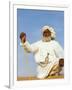 Bedouin Man Kneels on Top of a Sand Dune in the Desert-John Warburton-lee-Framed Photographic Print