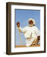 Bedouin Man Kneels on Top of a Sand Dune in the Desert-John Warburton-lee-Framed Photographic Print