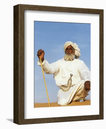 Bedouin Man Kneels on Top of a Sand Dune in the Desert-John Warburton-lee-Framed Photographic Print