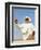 Bedouin Man Kneels on Top of a Sand Dune in the Desert-John Warburton-lee-Framed Photographic Print