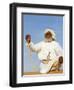 Bedouin Man Kneels on Top of a Sand Dune in the Desert-John Warburton-lee-Framed Photographic Print