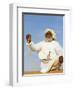 Bedouin Man Kneels on Top of a Sand Dune in the Desert-John Warburton-lee-Framed Photographic Print