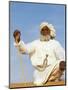 Bedouin Man Kneels on Top of a Sand Dune in the Desert-John Warburton-lee-Mounted Photographic Print