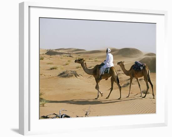 Bedu Rides His Camel Amongst the Sand Dunes in the Desert-John Warburton-lee-Framed Photographic Print