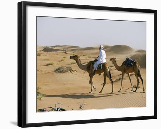 Bedu Rides His Camel Amongst the Sand Dunes in the Desert-John Warburton-lee-Framed Photographic Print