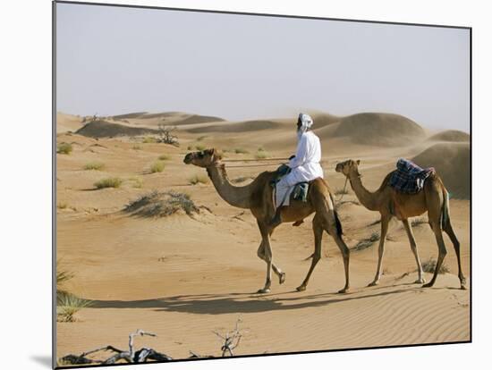 Bedu Rides His Camel Amongst the Sand Dunes in the Desert-John Warburton-lee-Mounted Photographic Print