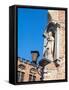 Belgium, Brugge. A stone statue on the cornerstone of a building.-Julie Eggers-Framed Stretched Canvas