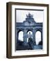 Belgium, Brussels; a Girl Walking with an Umbrella in Front of the Arc Du Triomphe-Ken Sciclina-Framed Photographic Print