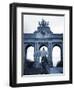 Belgium, Brussels; a Girl Walking with an Umbrella in Front of the Arc Du Triomphe-Ken Sciclina-Framed Photographic Print