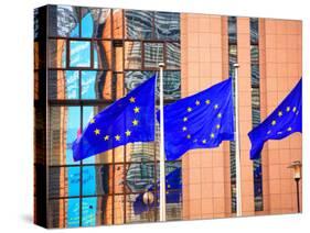 Belgium, Brussels; Three Flags Carrying the European Union Emblem in Front of the E;U Headquarters-Ken Sciclina-Stretched Canvas