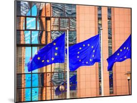 Belgium, Brussels; Three Flags Carrying the European Union Emblem in Front of the E;U Headquarters-Ken Sciclina-Mounted Photographic Print