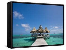 Belize, Ambergris Caye, San Pedro, Ramons Village Resort Pier and Palapa-Jane Sweeney-Framed Stretched Canvas