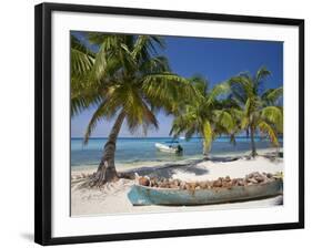 Belize, Laughing Bird Caye, Canoe Filled with Coconut Husks on Beach-Jane Sweeney-Framed Photographic Print