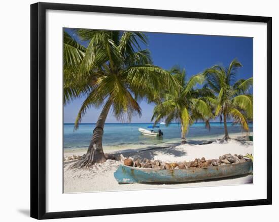 Belize, Laughing Bird Caye, Canoe Filled with Coconut Husks on Beach-Jane Sweeney-Framed Photographic Print