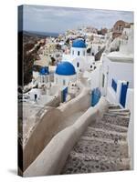 Bell Tower and Blue Domes of Church in Village of Oia, Santorini, Greece-Darrell Gulin-Stretched Canvas