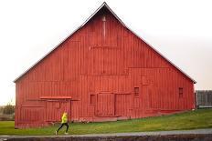 Male Runner Runs Along A Gravel Trail In Front Of Bright Red Barn In UI Arboretum In Moscow, Idaho-Ben Herndon-Photographic Print