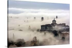 Bergamo, Lombardy, Italy. Foggy sunrise over high city.-ClickAlps-Stretched Canvas