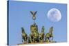 Berlin, Germany. Close-up of the Quadriga atop the Brandenburg gate with the full moon.-Miva Stock-Stretched Canvas