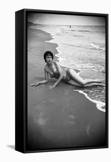 Bernadette Lafont, as a young woman, on the beach, south of France, c. 1955 (b/w photo)-null-Framed Stretched Canvas