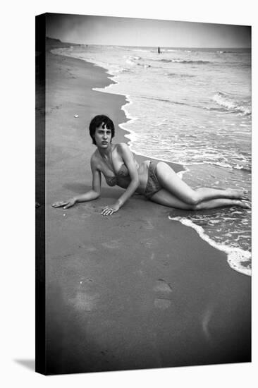 Bernadette Lafont, as a young woman, on the beach, south of France, c. 1955 (b/w photo)-null-Stretched Canvas