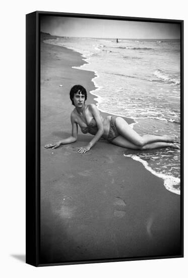 Bernadette Lafont, as a young woman, on the beach, south of France, c. 1955 (b/w photo)-null-Framed Stretched Canvas