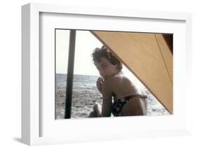 Bernadette Lafont, as a young woman, on the beach, south of France, c. 1955 (photo)-null-Framed Photo