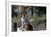 Bernadette Lafont, as a young woman, with her dog in Nimes, south of France, c. 1955 (photo)-null-Framed Photo