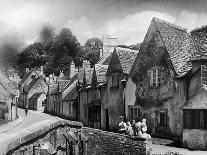 Young boy looking in shop window in the Cotswolds, 1935-Bernard Alfieri-Mounted Photographic Print