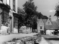 Young boy looking in shop window in the Cotswolds, 1935-Bernard Alfieri-Framed Stretched Canvas