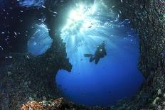 Scuba Diver Swimming through an Arch-Bernard Radvaner-Photographic Print