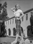 Jayne Mansfield Posed in White Short Sleeve Shirt and Black High Waist Tight Pants with Left Waist-Bert Six-Photo