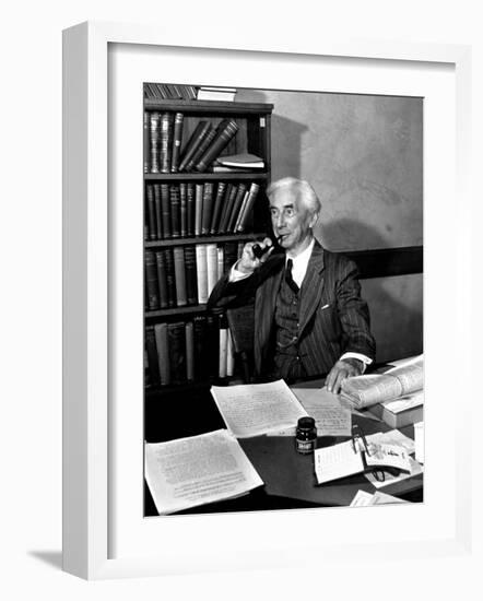 Bertrand Russell Sitting at His Desk at California University at Los Angeles-Peter Stackpole-Framed Photographic Print