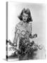 Bette Davis Arranging Flowers-null-Stretched Canvas