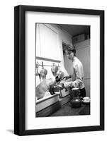 Bettina Graziani Prepares Coffee in Her Kitchen with One of Her Siamese Cats, Paris, France, 1952-Nat Farbman-Framed Photographic Print