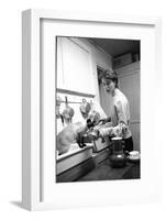 Bettina Graziani Prepares Coffee in Her Kitchen with One of Her Siamese Cats, Paris, France, 1952-Nat Farbman-Framed Photographic Print