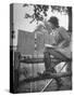 Betty Jane Baldwin Sitting on Fence and Looking at Official Board at Warrenton Horse Show-Martha Holmes-Stretched Canvas