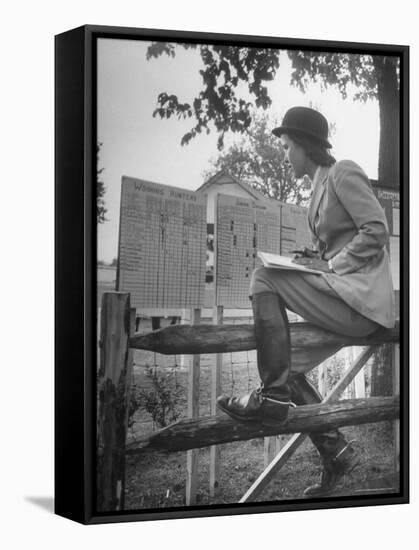 Betty Jane Baldwin Sitting on Fence and Looking at Official Board at Warrenton Horse Show-Martha Holmes-Framed Stretched Canvas