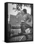 Betty Jane Baldwin Sitting on Fence and Looking at Official Board at Warrenton Horse Show-Martha Holmes-Framed Stretched Canvas