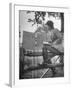 Betty Jane Baldwin Sitting on Fence and Looking at Official Board at Warrenton Horse Show-Martha Holmes-Framed Photographic Print