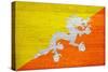 Bhutan Flag Design with Wood Patterning - Flags of the World Series-Philippe Hugonnard-Stretched Canvas