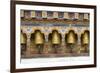 Bhutan. Spinning prayer wheels along a temple wall.-Brenda Tharp-Framed Photographic Print