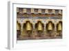 Bhutan. Spinning prayer wheels along a temple wall.-Brenda Tharp-Framed Photographic Print